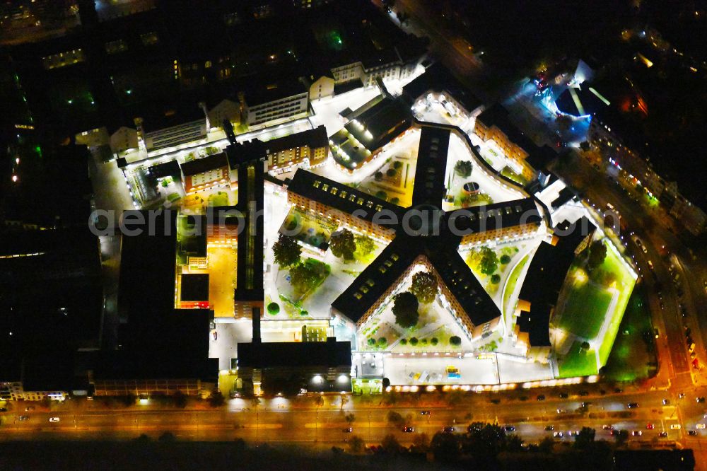 Berlin at night from above - Night lighting Prison grounds and high security fence Prison Berlin-Moabit in Alt-Moabit in the district Moabit in Berlin, Germany