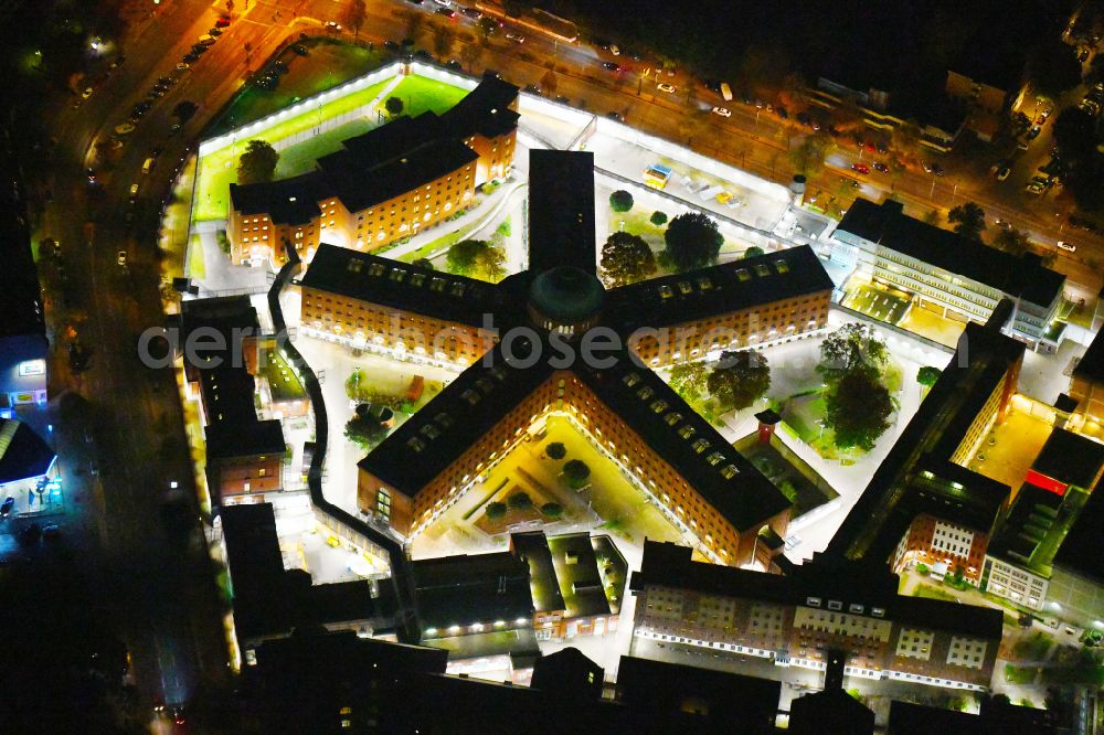 Aerial image at night Berlin - Night lighting Prison grounds and high security fence Prison Berlin-Moabit in Alt-Moabit in the district Moabit in Berlin, Germany