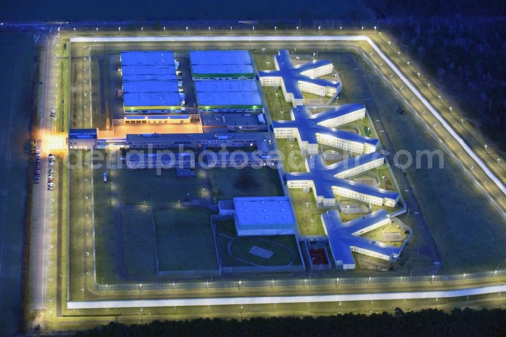 Aerial image at night Burg - Night lighting prison grounds and high security fence Prison in Burg in the state Saxony-Anhalt