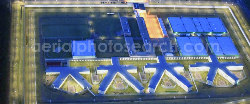 Aerial image at night Burg - Night lighting prison grounds and high security fence Prison in Burg in the state Saxony-Anhalt