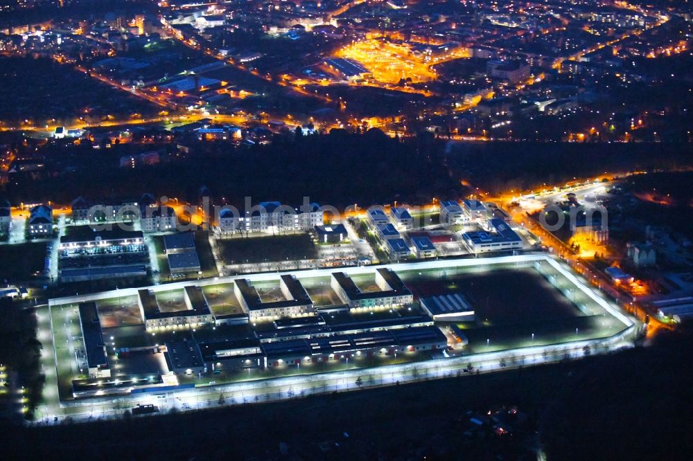 Dresden at night from the bird perspective: Night lighting prison grounds and high security fence Prison in the Hammerweg Dresden in Dresden in the state Saxony