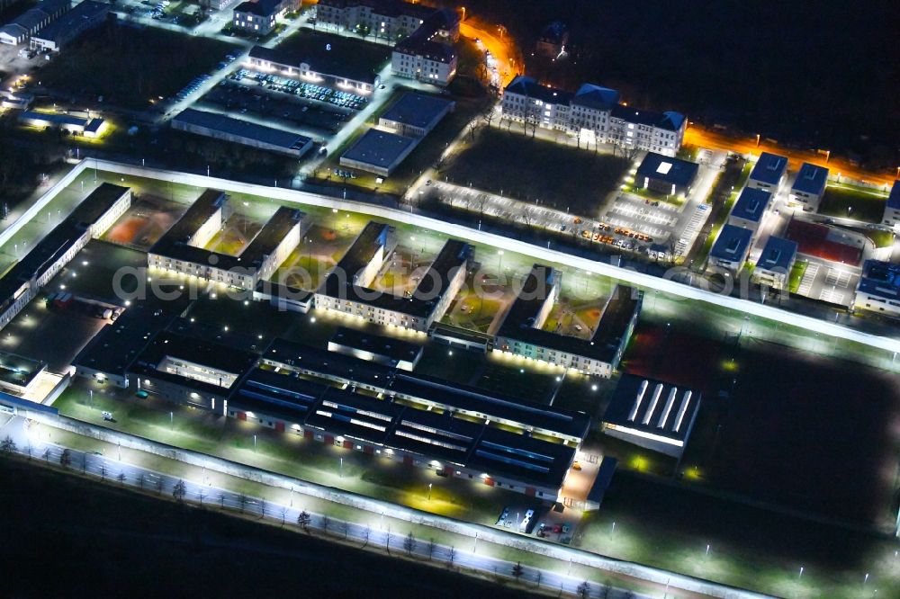 Aerial image at night Dresden - Night lighting prison grounds and high security fence Prison in the Hammerweg Dresden in Dresden in the state Saxony