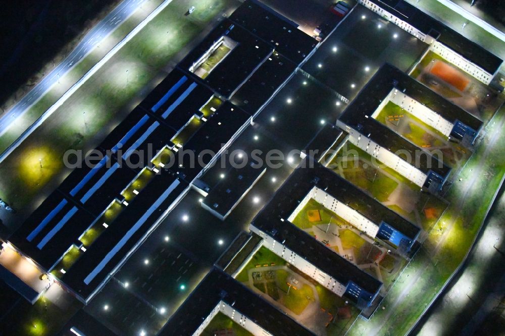 Dresden at night from the bird perspective: Night lighting prison grounds and high security fence Prison in the Hammerweg Dresden in Dresden in the state Saxony