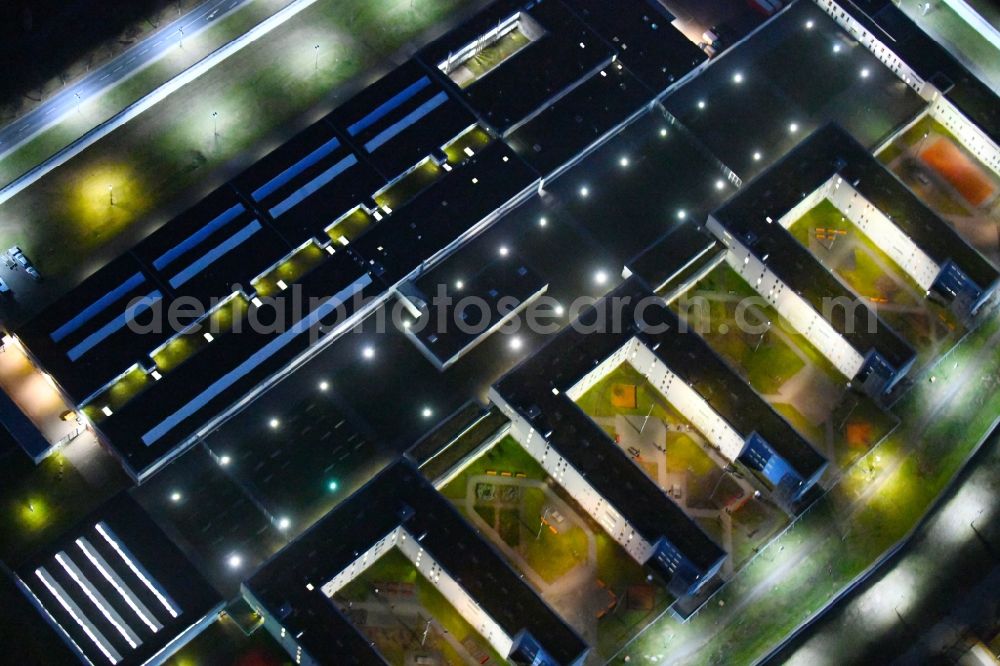 Aerial photograph at night Dresden - Night lighting prison grounds and high security fence Prison in the Hammerweg Dresden in Dresden in the state Saxony