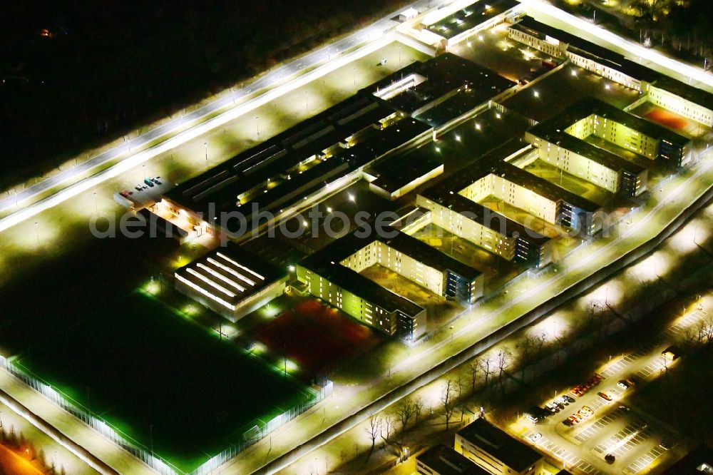 Aerial image at night Dresden - Night lighting prison grounds and high security fence Prison in the Hammerweg Dresden in Dresden in the state Saxony