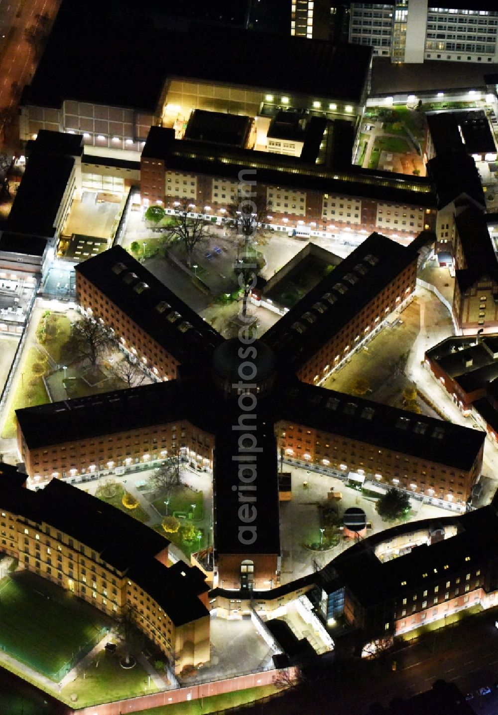 Berlin at night from above - Night view of prison grounds and high security fence Prison Moabit in Alt-Moabit in Berlin