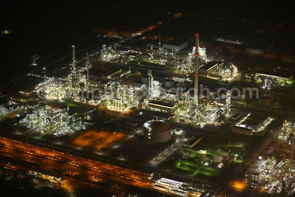 Schwedt/Oder at night from above - Night lighting Site of PCK Refinery GmbH, a petroleum processing plant in Schwedt / Oder in the northeast of the state of Brandenburg