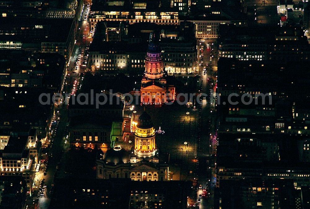 Aerial image at night Berlin - Gendarmenmarkt with the building ensemble German and French Cathedral, Schauspielhaus at night in Berlin Mitte