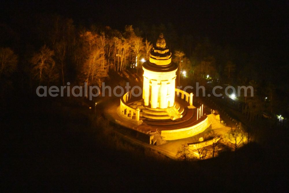 Aerial image at night Eisenach - Night lighting Tourist attraction of the historic monument Burschenschaftsdenkmal An of Goepelskuppe in Eisenach in the state Thuringia, Germany