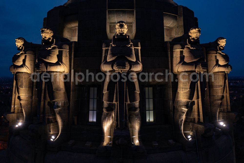 Leipzig at night from above - Night lighting Tourist attraction of the historic monument Voelkerschlachtdenkmal on Strasse of 18. Oktober in Leipzig in the state Saxony, Germany