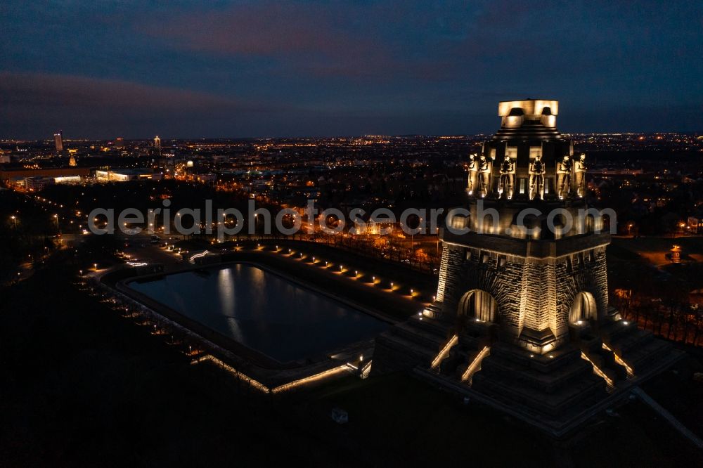 Leipzig at night from above - Night lighting Tourist attraction of the historic monument Voelkerschlachtdenkmal on Strasse of 18. Oktober in Leipzig in the state Saxony, Germany