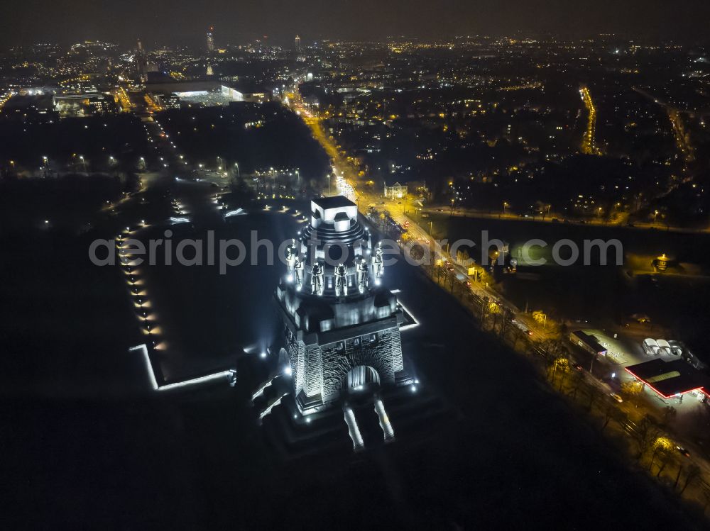 Leipzig at night from the bird perspective: Night lighting tourist attraction of the historic monument Voelkerschlachtdenkmal on Strasse of 18. Oktober in Leipzig in the state Saxony, Germany