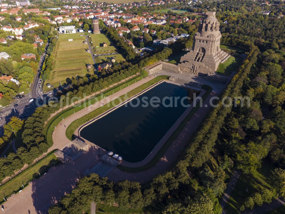 Aerial image at night Leipzig - Night lighting tourist attraction of the historic monument Voelkerschlachtdenkmal on Strasse of 18. Oktober in Leipzig in the state Saxony, Germany