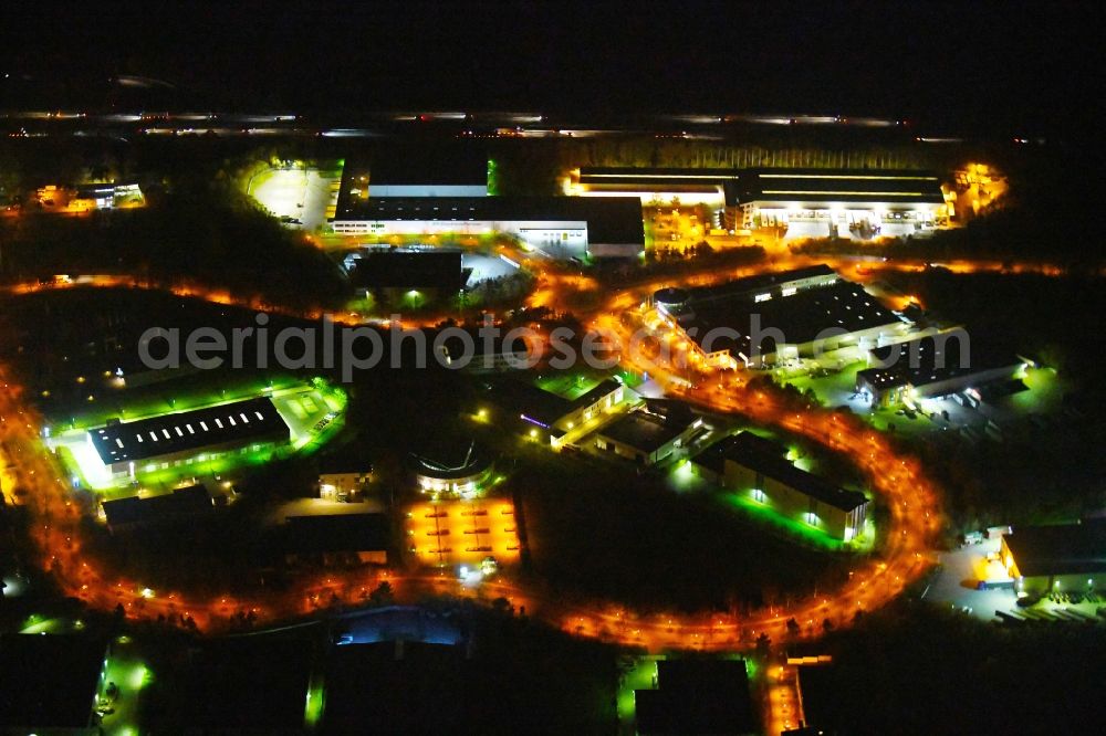 Ludwigsfelde at night from above - Night lighting Industrial estate and company settlement of Brandenburg Park Immobilien GmbH in Ludwigsfelde in the state Brandenburg, Germany