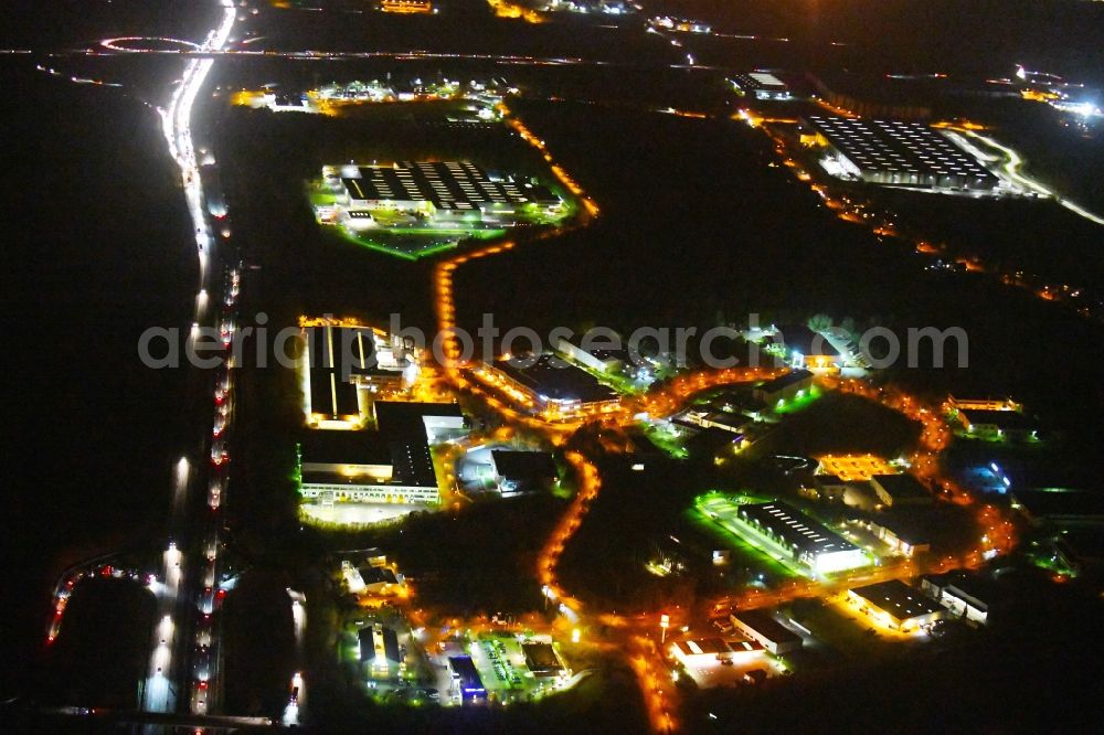 Aerial photograph at night Ludwigsfelde - Night lighting Industrial estate and company settlement of Brandenburg Park Immobilien GmbH in Ludwigsfelde in the state Brandenburg, Germany