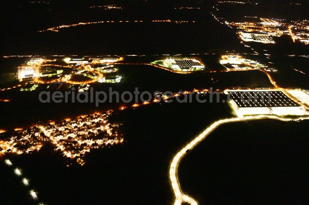 Aerial photograph at night Ludwigsfelde - Night lighting industrial estate and company settlement Brandenburg Park in Ludwigsfelde in the state Brandenburg, Germany