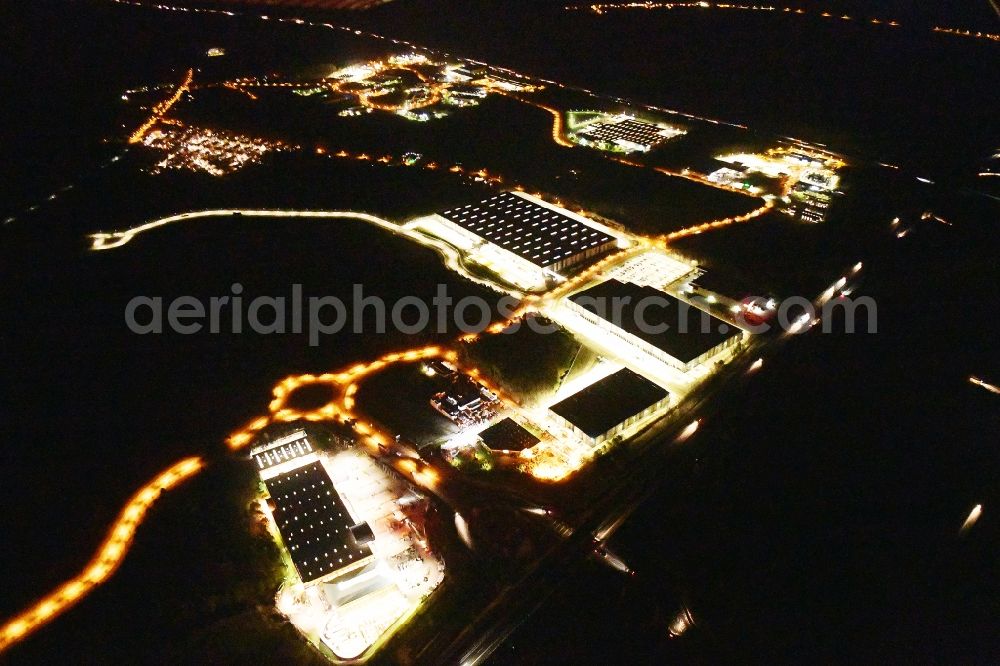 Aerial photograph at night Ludwigsfelde - Night lighting industrial estate and company settlement Brandenburg Park in Ludwigsfelde in the state Brandenburg, Germany