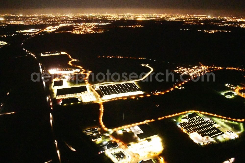 Aerial image at night Ludwigsfelde - Night lighting industrial estate and company settlement Brandenburg Park in Ludwigsfelde in the state Brandenburg, Germany