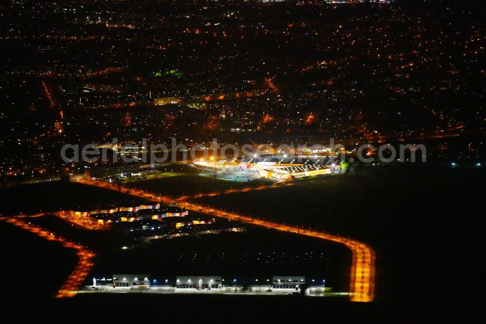 Berlin at night from above - Night lighting Industrial estate and company settlement Business Park Berlin on Alexander-Meissner-Strasse in Berlin, Germany