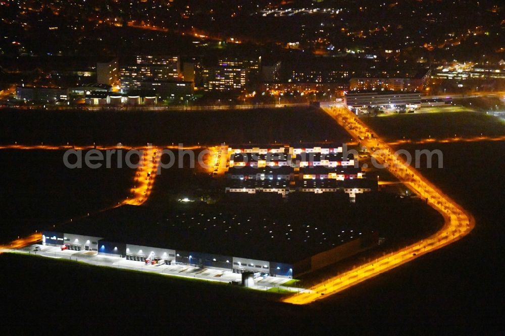 Aerial photograph at night Berlin - Night lighting Industrial estate and company settlement Business Park Berlin on Alexander-Meissner-Strasse in Berlin, Germany