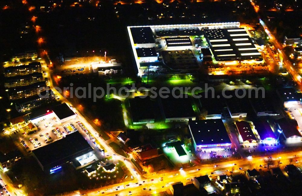 Berlin at night from above - Night lighting Industrial estate and company settlement along the Strasse Alt-Mahlsdorf in the district Mahlsdorf in Berlin, Germany