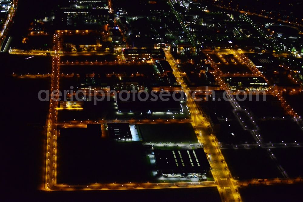 Berlin at night from the bird perspective: Night aerial industrial area and development area at the Greater Berlin Dam on the grounds of the former airport Johannisthal in Berlin