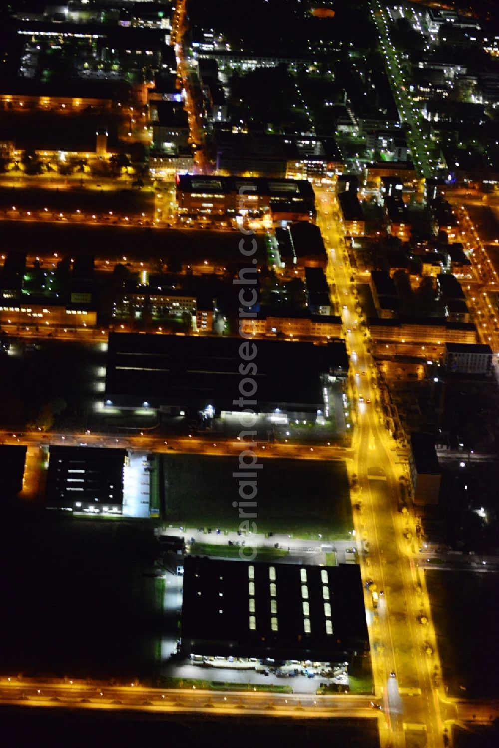 Aerial image at night Berlin - Night aerial industrial area and development area at the Greater Berlin Dam on the grounds of the former airport Johannisthal in Berlin