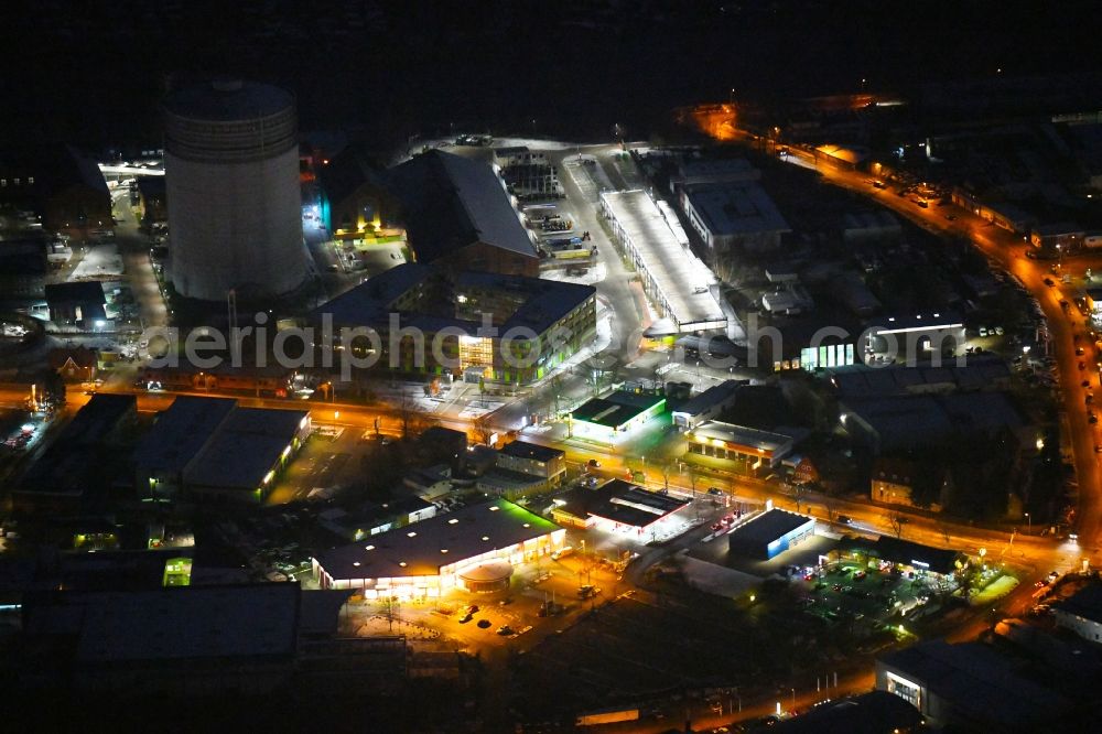 Lübeck at night from above - Night lighting industrial estate and company settlement Geniner Strasse - Bei of Gasanstalt - Hinter den Kirschkaten in Luebeck in the state Schleswig-Holstein, Germany