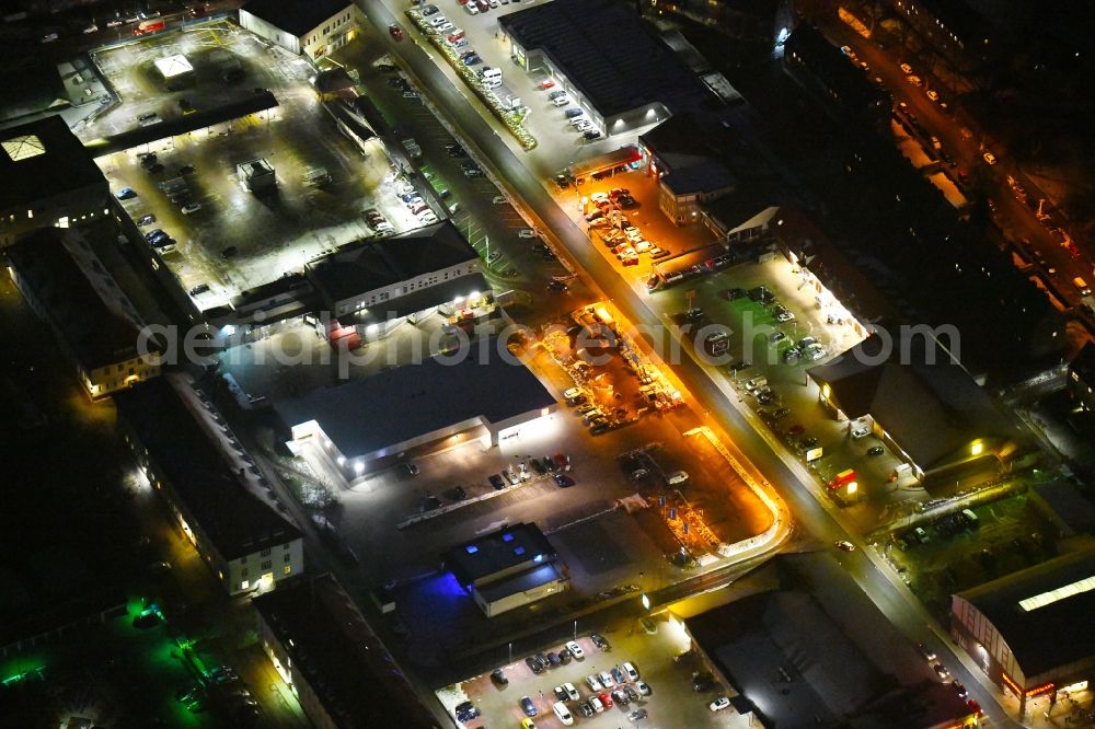 Aerial image at night Lübeck - Night lighting industrial estate and company settlement Kantstrasse in the district Marli - Brandenbaum in Luebeck in the state Schleswig-Holstein, Germany