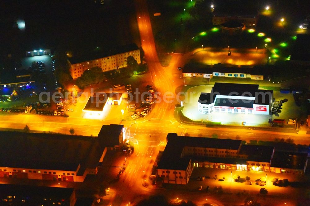 Güstrow at night from above - Night lighting Industrial estate and company settlement Rostocker Chaussee in Guestrow in the state Mecklenburg - Western Pomerania, Germany