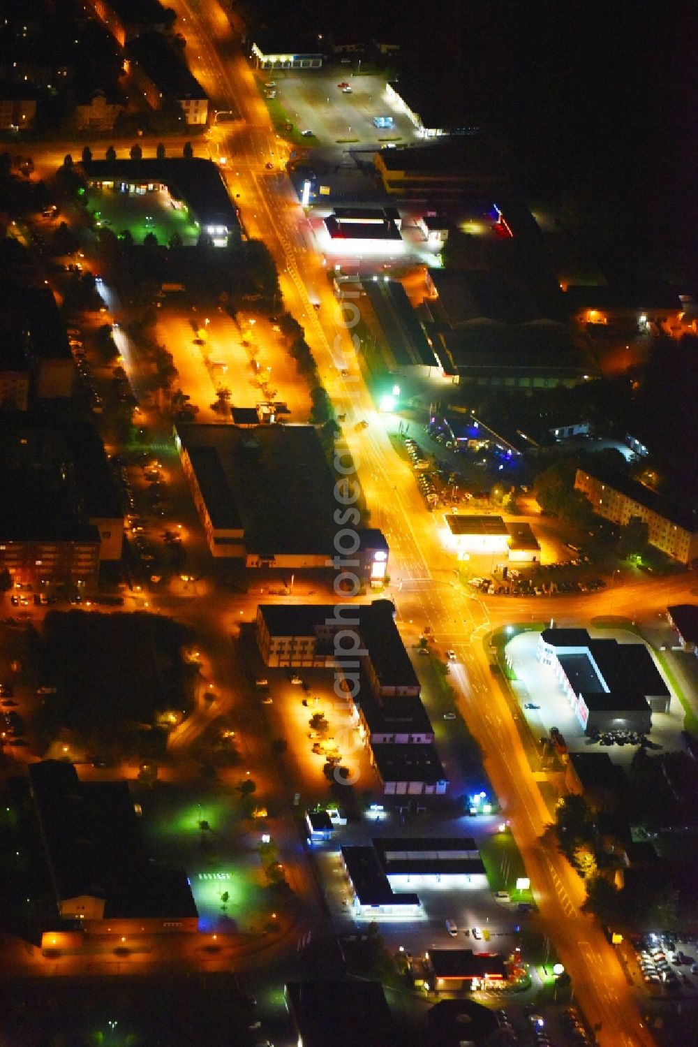 Aerial image at night Güstrow - Night lighting Industrial estate and company settlement Rostocker Chaussee in Guestrow in the state Mecklenburg - Western Pomerania, Germany