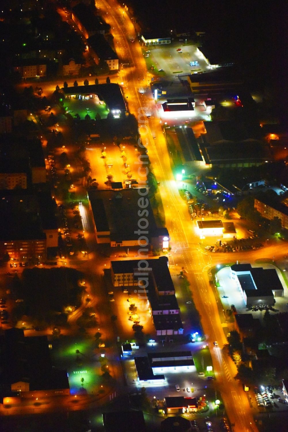 Güstrow at night from above - Night lighting Industrial estate and company settlement Rostocker Chaussee in Guestrow in the state Mecklenburg - Western Pomerania, Germany