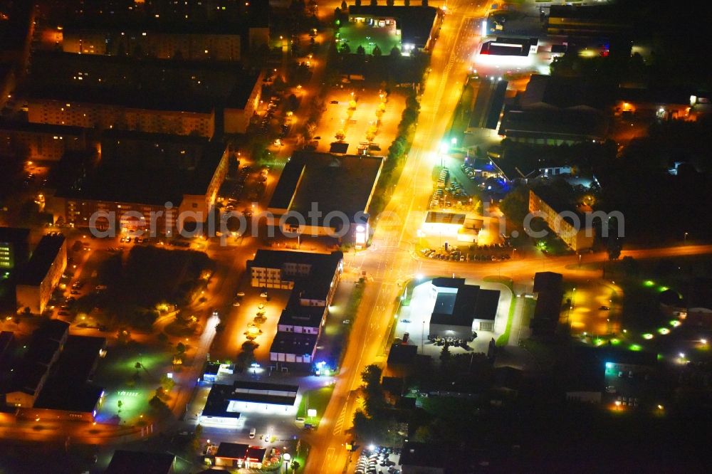 Aerial photograph at night Güstrow - Night lighting Industrial estate and company settlement Rostocker Chaussee in Guestrow in the state Mecklenburg - Western Pomerania, Germany