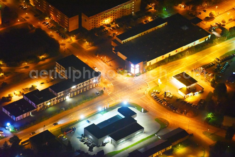 Güstrow at night from above - Night lighting Industrial estate and company settlement Rostocker Chaussee in Guestrow in the state Mecklenburg - Western Pomerania, Germany