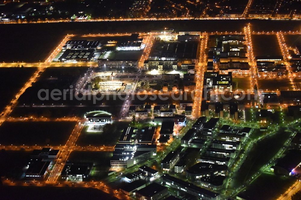 Berlin at night from the bird perspective: Night lighting industrial estate and company settlement Technologiepark Adlershof in the district Adlershof - Johannisthal in Berlin, Germany