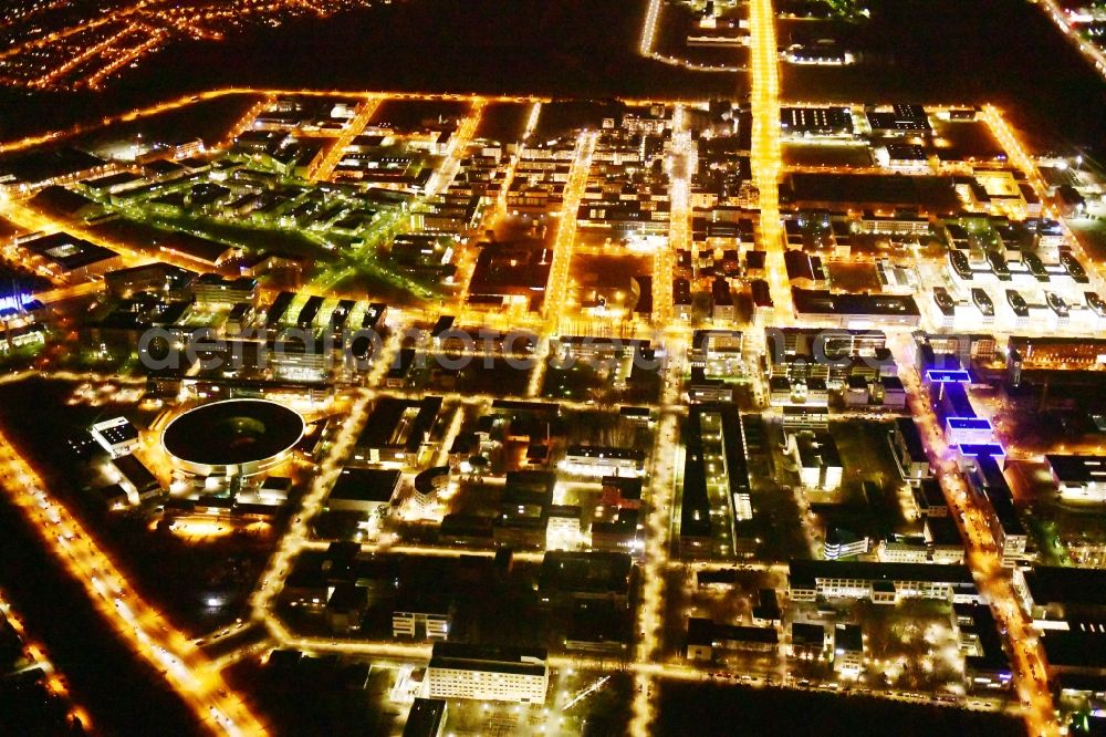 Berlin at night from the bird perspective: Night lighting industrial estate and company settlement Technologiepark Adlershof in the district Adlershof - Johannisthal in Berlin, Germany