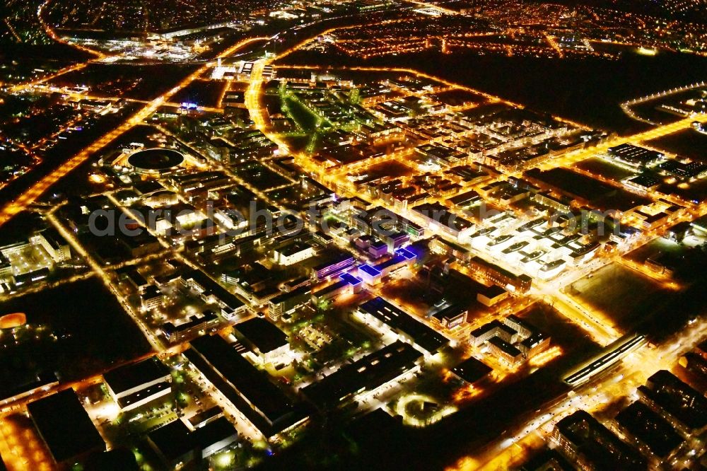 Berlin at night from the bird perspective: Night lighting industrial estate and company settlement Technologiepark Adlershof in the district Adlershof - Johannisthal in Berlin, Germany