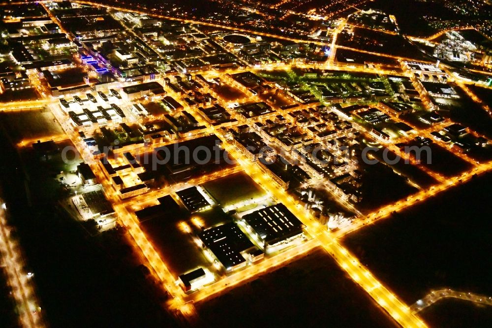 Berlin at night from the bird perspective: Night lighting industrial estate and company settlement Technologiepark Adlershof in the district Adlershof - Johannisthal in Berlin, Germany