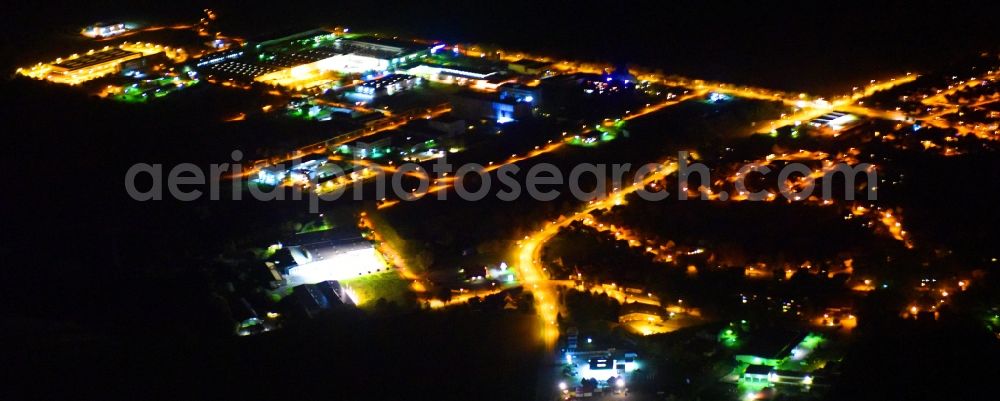 Weitin at night from above - Night lighting Industrial estate and company settlement on Justus-von-Liebig-Strasse in Weitin in the state Mecklenburg - Western Pomerania, Germany