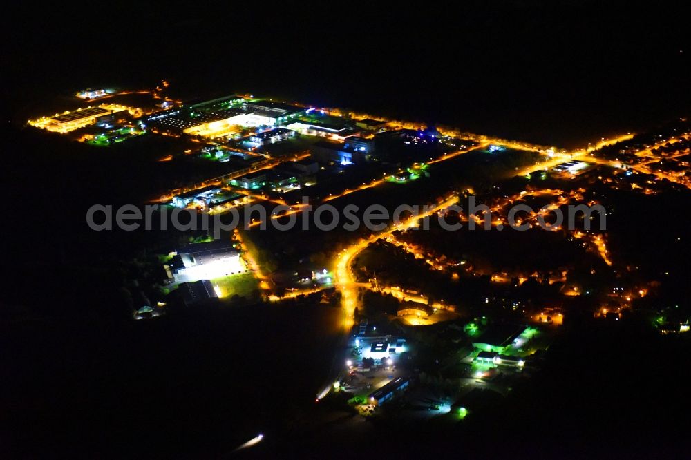 Weitin at night from the bird perspective: Night lighting Industrial estate and company settlement on Justus-von-Liebig-Strasse in Weitin in the state Mecklenburg - Western Pomerania, Germany