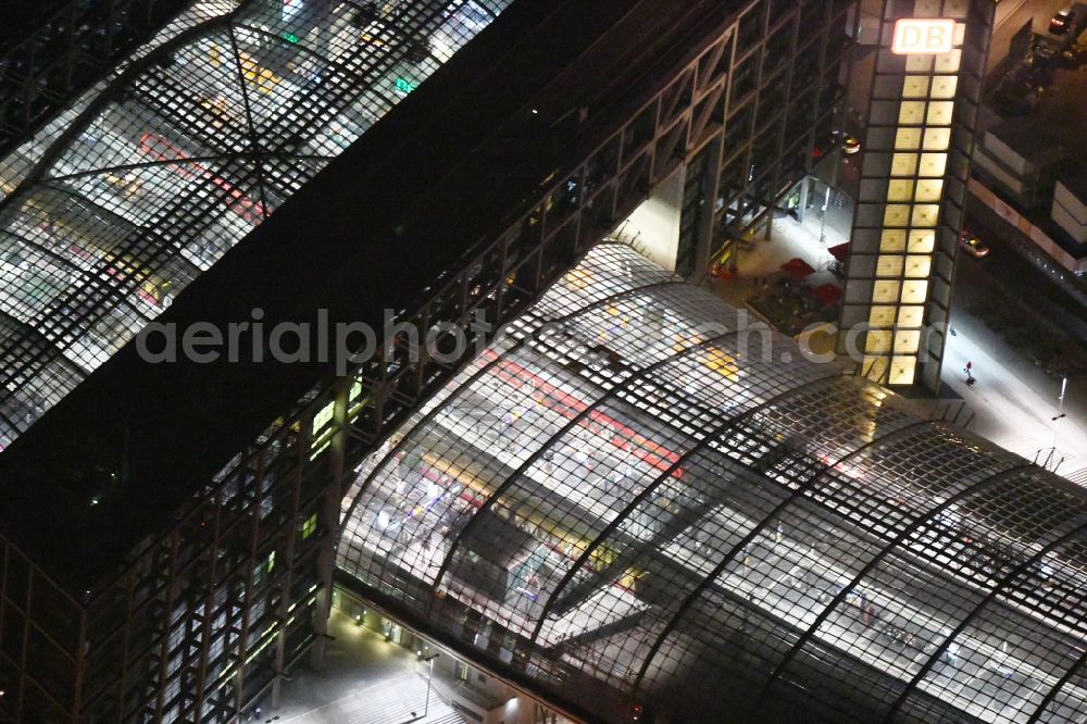 Berlin at night from the bird perspective: Night lighting Track progress and building of the main station of the railway in Berlin, Germany