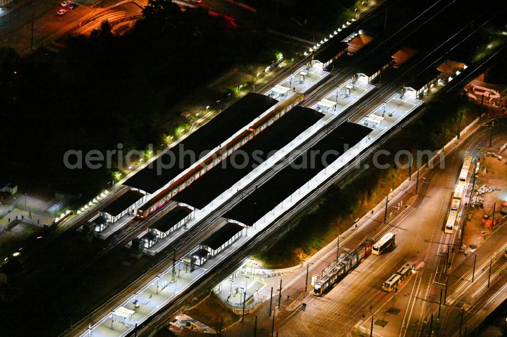 Berlin at night from above - Night lighting station building of S-Bahnhof Schoeneweide in the district Niederschoeneweide in Berlin, Germany