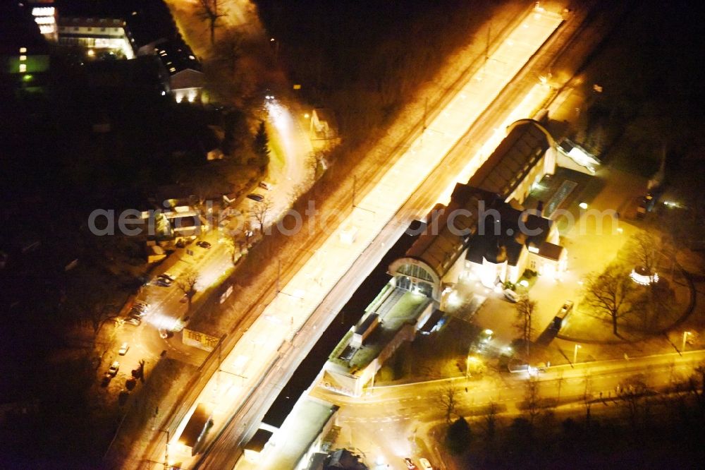 Aerial image at night Potsdam - Night view station railway building of the Deutsche Bahn in Potsdam in the state Brandenburg