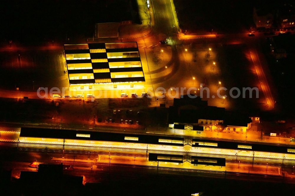 Aerial image at night Gotha - Night lighting station railway building of the Deutsche Bahn in Gotha in the state Thuringia, Germany