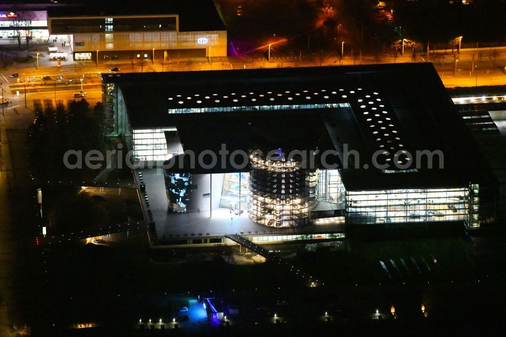 Dresden at night from above - Night lighting VW transparent factory in Dresden in Saxony. The transparent factory is a Dresden automobile factory of Volkswagen AG, which is operated by the Volkswagen Sachsen GmbH