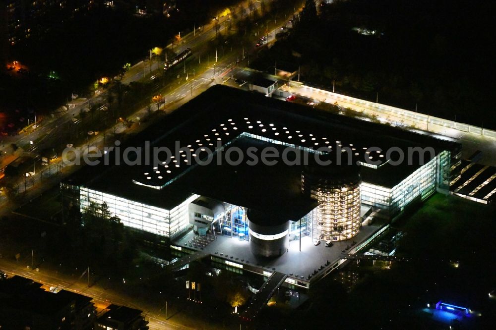 Aerial image at night Dresden - Night lighting vW transparent factory in Dresden in Saxony. The transparent factory is a Dresden automobile factory of Volkswagen AG, which is operated by the Volkswagen Sachsen GmbH