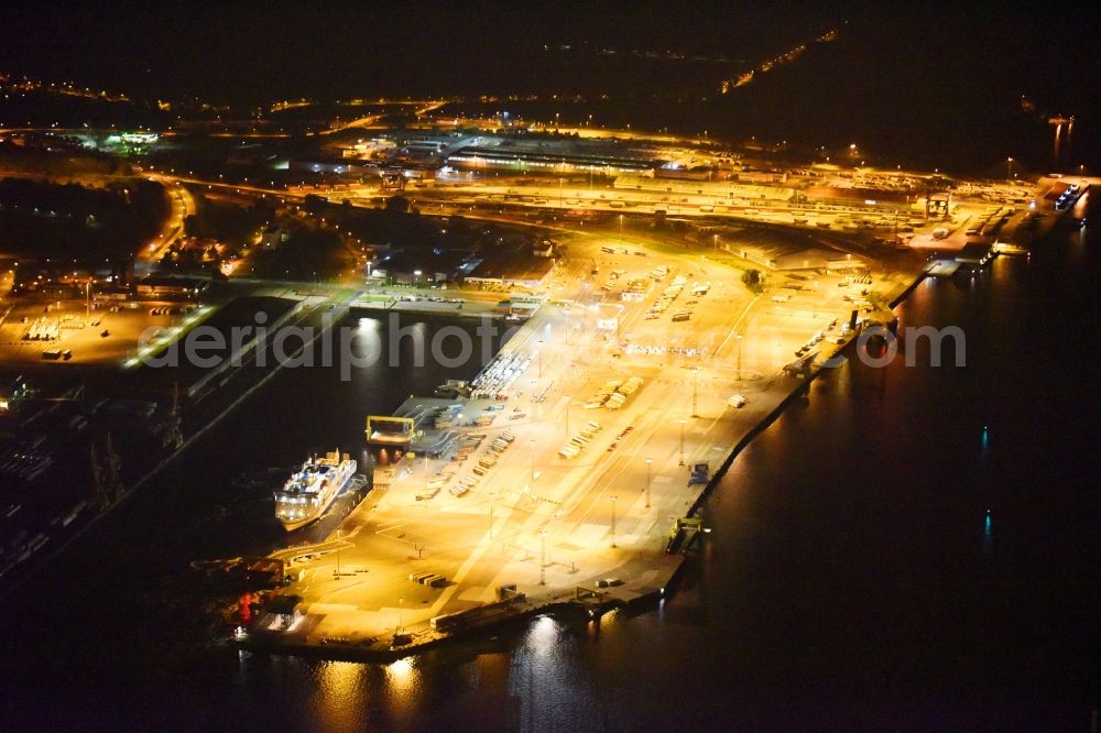 Aerial image at night Rostock - Night lighting Port facilities on the shores of the harbor of Faehrterminal in Rostock in the state Mecklenburg - Western Pomerania, Germany