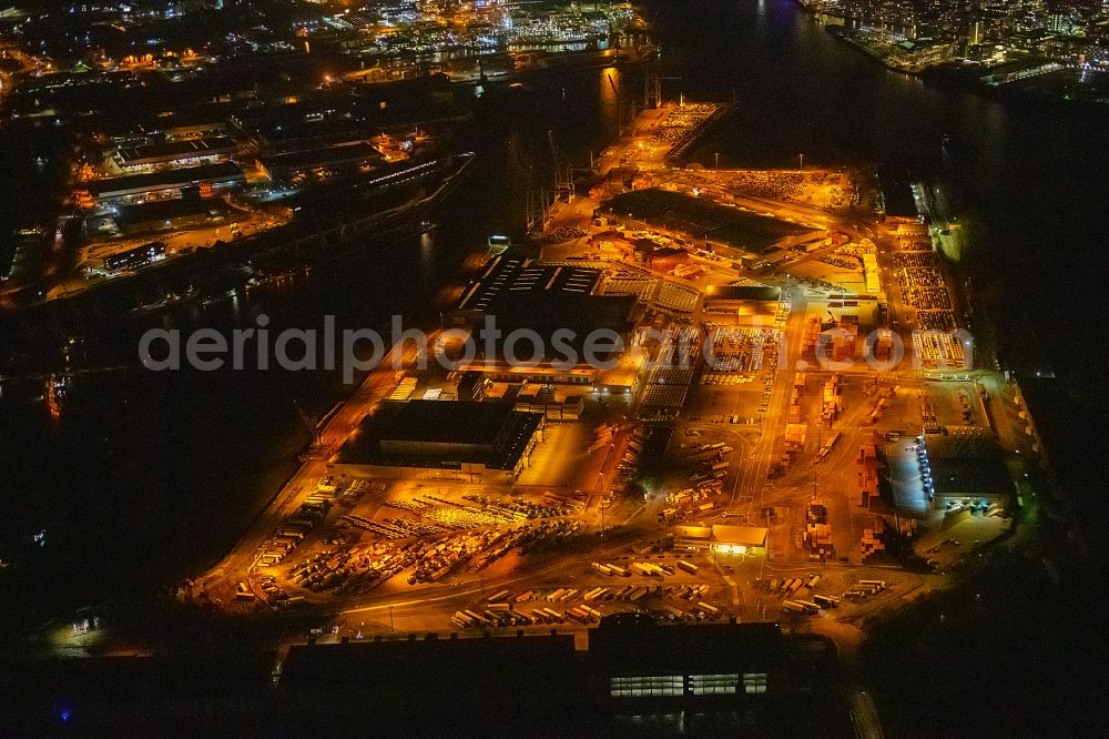 Hamburg at night from above - Night lighting Port facilities on the shores of the harbor of Kleiner Grasbrook in Hamburg, Germany