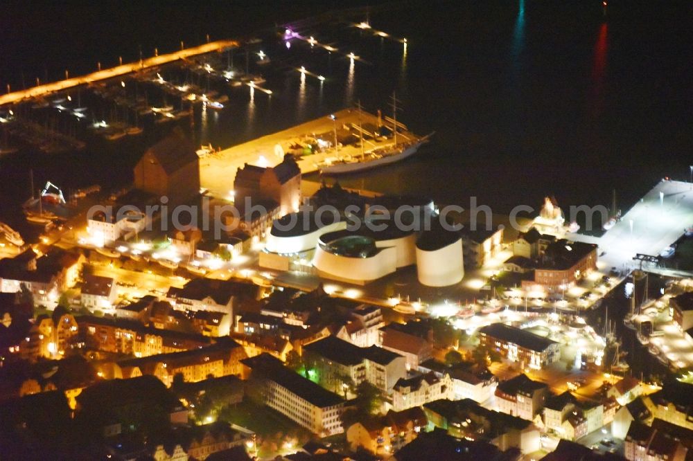 Aerial photograph at night Stralsund - Night lighting Harbor island by Ozeaneum Oceanographic Museum in Stralsund in Mecklenburg - Western Pomerania