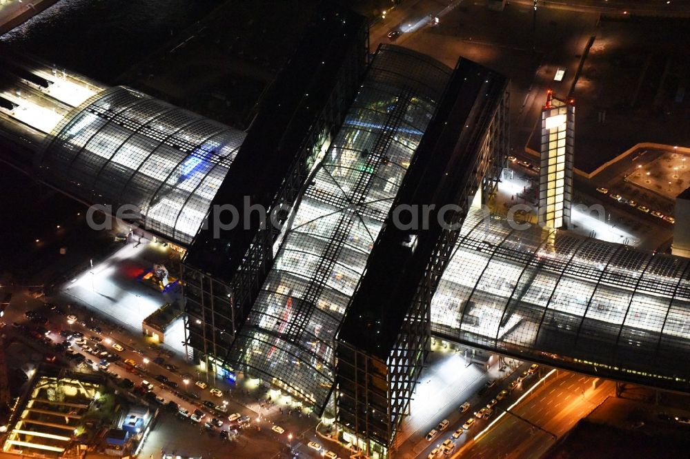 Aerial photograph at night Berlin - Night view of track progress and building of the main station of the railway in Berlin in Germany